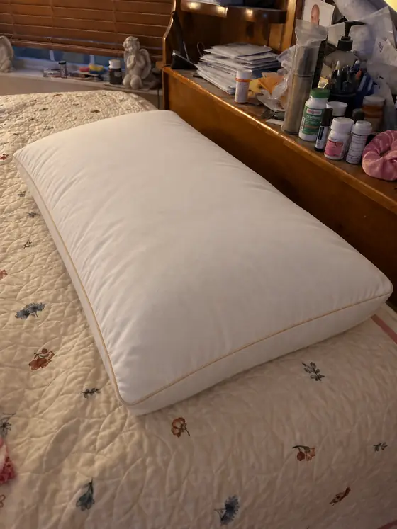 Customer photo from Jennifer L.: the pillow on a quilted bedspread